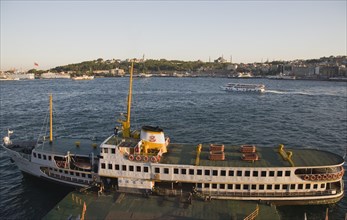 Istanbul, Turkey. Sultanahmet. Bosphorous passenger ferry moored at sunset with the Hagia Sophia