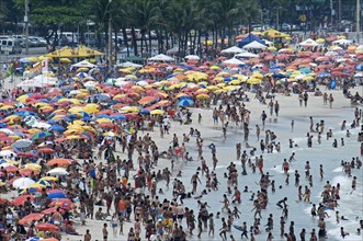 Rio de Janeiro, Brazil. Copacabana beach. Crowds on the beach and in the sea bikinis and