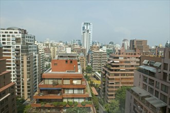 Santiago, Chile. Multistorey apartment blocks with wide balconies and greenery in the upmarket