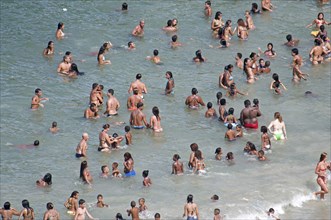 Rio de Janeiro, Brazil. Copacabana beach. Multi racial singles children and family groups in the