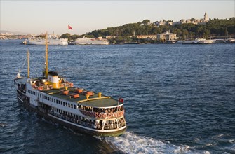 Istanbul, Turkey. Sultanahmet Crowded Bosphorous passenger ferry at sunset. Turkey Turkish Istanbul
