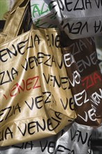 Venice, Veneto, Italy. Shopping bags on souvenir stall for sale opposite St Marks Square in the