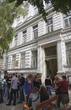 Vienna, Austria. Neubau District. Students gathered outside college building entrance. Austria