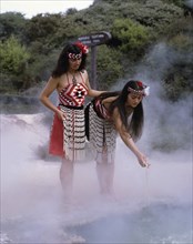 Rotorua, North Island, New Zealand. Thermal Pools with Maori girls in traditional dress. New