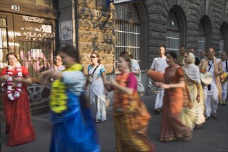 Budapest, Pest County, Hungary. Hare Krishna devotees singing and dancing on Andrassy UtIn Pest