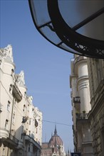 Budapest, Pest County, Hungary. Art Nouveau era apartment facades with view towards the Hungarian