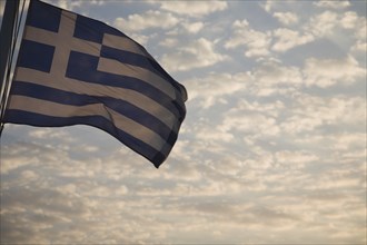 Samos, Northern Aegean, Greece. Greek flag flying from ferry between Samos and Kusadasi in Turkey