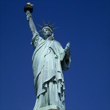 New York, New York State, USA. Statue of Liberty. Close view of figure and torch against a bright