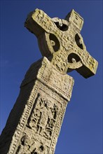 Clones, County Monaghan, Ireland. Celtic Cross against blue sky. Ireland Irish Eire Erin Europe