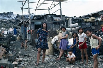 Manila, Luzon Island, Philippines. Smokey Mountain slum area. Children living off rubbish tip.