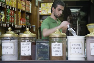 Istanbul, Turkey. Sultanahmet. Coffee or kahve shop and young male vendor in the The Spice Bazaar