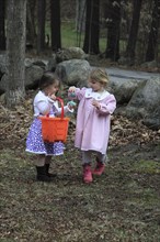 Young girls Kylan Stone and Sarah Bleau hunting for Easter eggs in Keene New Hampshire. Festival
