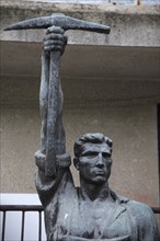 Tirana, Albania. Statue of communist worker holding pickaxe. Albanian Shqip‘ria Southern Europe