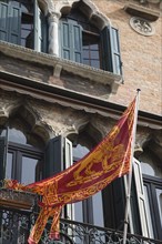 Venice, Veneto, Italy. Centro Storico Republic of Venice flag depicting winged lion of St. Mark on