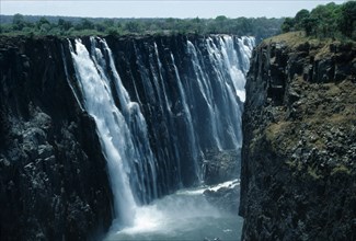 Victoria Falls, Zimbabwe. Zambezi River plunging into gorge. African Eastern Africa Scenic
