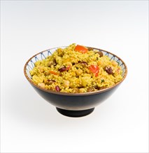 Bowl of vegetarian couscous with fruit on a white background. Food Cooked Couscous Cous cous Bowl