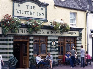 Brighton, East Sussex, England. Victory Inn Public House on Duke Street. People sitting at tables
