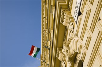 Budapest, Pest County, Hungary. Renovated facade on Pest bank of Danube with Hungarian flag.