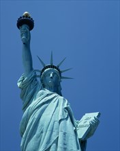 New York, New York State, USA. Statue of Liberty. Detail id upper torso of green statue holding