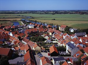 Denmark, Ribe, View west over city rooftops towards farmland and the River Ribea from the twelth