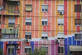 Albania, Tirane, Tirana, Detail of exterior facade of apartment block painted in stripes of