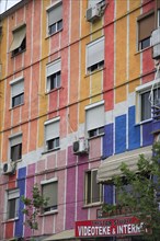 Albania, Tirane, Tirana, Part view of exterior facade of apartment block painted in brightly