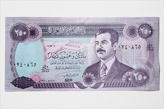 Iraq, Business, Finance, Money. An Iraqi bank note featuring portrait of former president Saddam