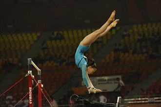 India, Delhi, 2010 Commonwealth Games  Female gymnastics  Asymmetrical bars exercise.