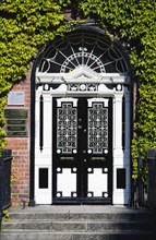 Ireland, County Dublin, Dublin City, Ornate black and white Georgian door in the city centre south