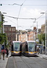Ireland, County Dublin, Dublin City, Luas light rail trams at stop beside Saint Stephens Green with