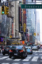 USA, New York, New York City, Manhattan  Cars crossing Broadway at green traffic lights travelling