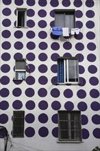 Albania, Tirane, Tirana, Part view of exterior facade of apartment block painted with pattern of