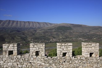 Albania, Berat, Crenellated battlements of ancient castle with cannons.
