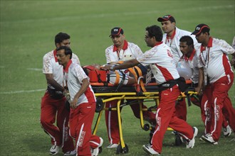 India, Delhi, 2010 Commonwealth games  Rugby game  injured player being taken off the pitch on