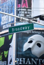 USA, New York, New York City, Manhattan  Overhead road sign for Broadway with theatre stage show