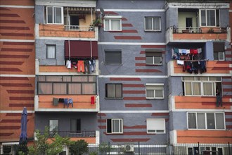 Albania, Tirane, Tirana, Colourful apartment buildings  part view of exterior facade with washing