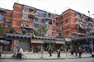 Albania, Tirane, Tirana, Colourful apartment buildings with washing hanging from balconies and