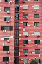 Albania, Tirane, Tirana, Part view of exterior facade of colourful apartment building with