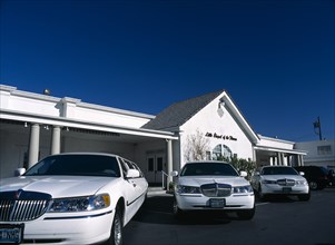 USA, Nevada, Las Vegas, Little Chapel of the Flowers  Wedding Chapel with three white limousines