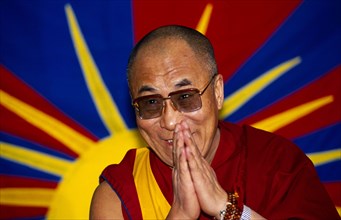 China, Tibet, Religious, The Dalai Lama smiling with hands raised in a traditional anjali greeting