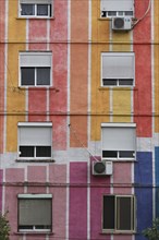 Albania, Tirane, Tirana, Detail of exterior facade of striped  multi-coloured apartment block with