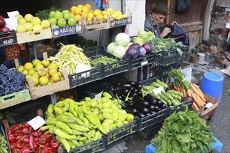 Albania, Tirane, Tirana, Display of fruit and vegetables including peppers  cabbage and grapes at