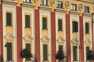 Albania, Tirane, Tirana, Detail of red and yellow exterior facade of government buildings on