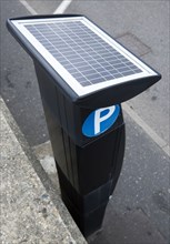 Transport, Road, Parking, Solar panel powered Pay & Display parking meter on the sidewalk pavement
