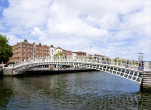 Ireland, County Dublin, Dublin City, The 1816 cast iron Ha Penny or Half Penny Bridge across the
