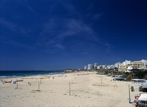 Portugal, Algarve, Praia da Rocha, View along beach with clifftop hotels