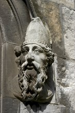 Ireland, Dublin, Building detail of a carved stone face depicting a bearded man