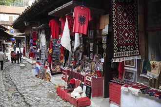 Albania, Kruja, Souvenir shops in the cobbled market bazaar in the old town.