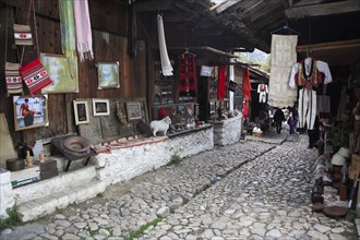Albania, Kruja, Souvenir shops in the cobbled market bazaar in the old town.