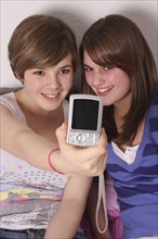 Children, Teenagers, Girls, Two teenage girls taking a photo of themselves.